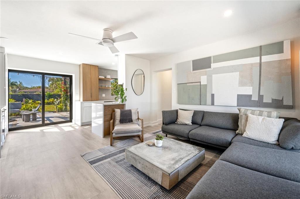 4608 Normandy Drive Naples, FL 34112 - Photo 5 of 49 a living room with furniture and a large window