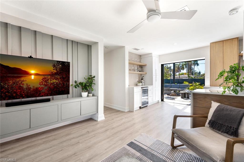 4608 Normandy Drive Naples, FL 34112 - Photo 6 of 49 a living room with furniture and a flat screen tv