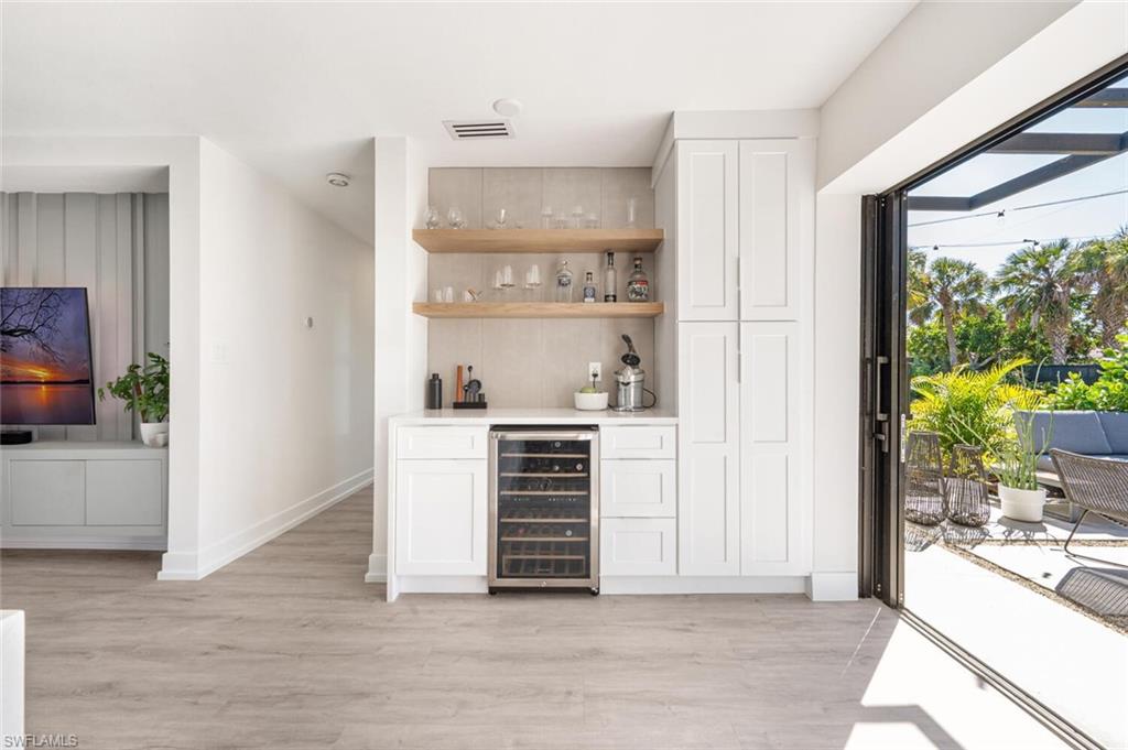 4608 Normandy Drive Naples, FL 34112 - Photo 7 of 49 a view of kitchen appliances cabinets and a window