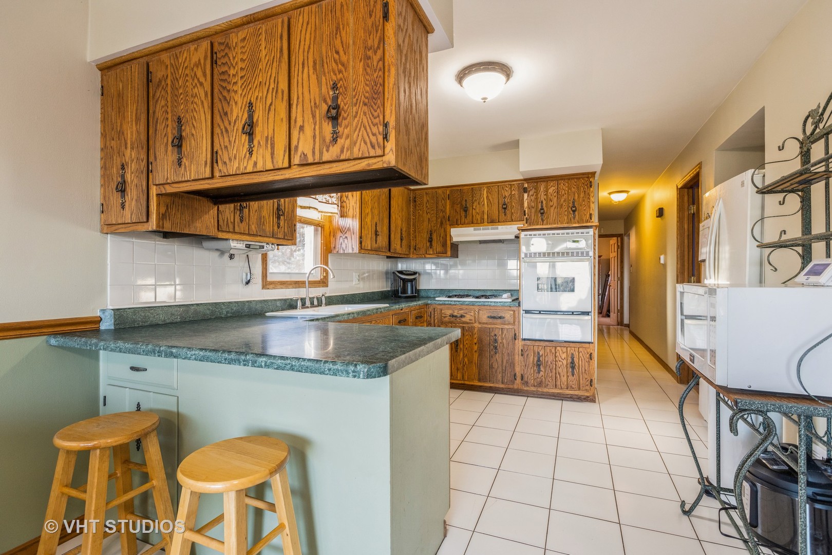 10817 West Bruns Road Monee, IL 60449 - Photo 3 of 21 a kitchen with stainless steel appliances granite countertop a sink and cabinets