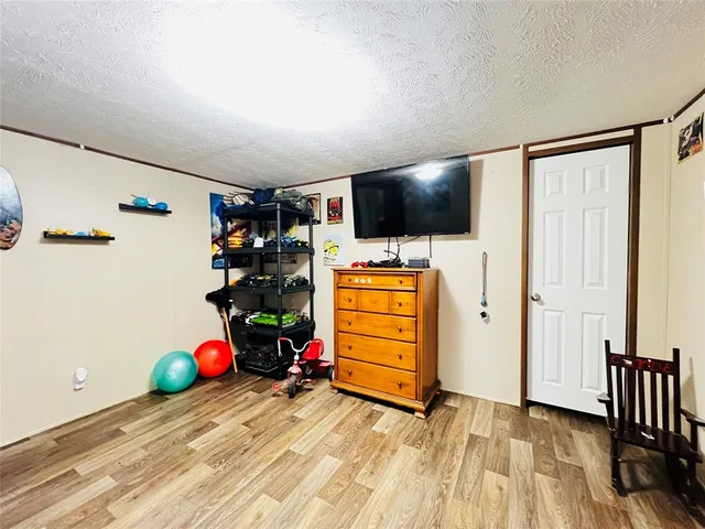 a room with furniture and flat screen tv