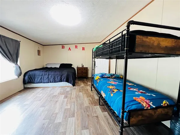 a bedroom with furniture and a window