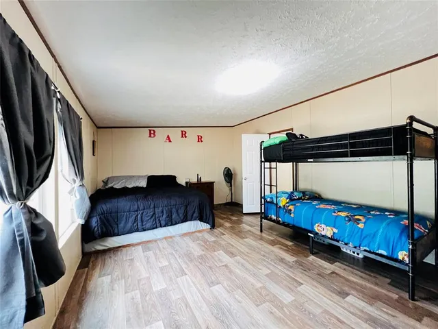 a bedroom with bed and window