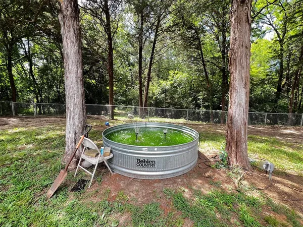 a view of outdoor space with deck and yard