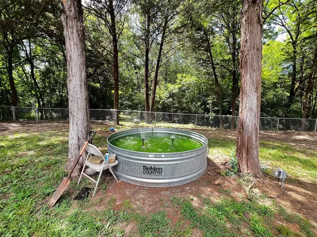 a view of outdoor space with deck and yard