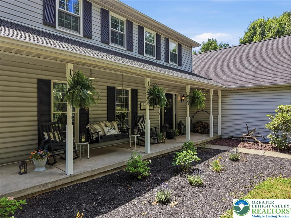 890 Lahr Road Nazareth, PA 18064 - Photo 65 of 71 A welcoming front porch, shaded by a canopy, invites relaxation.