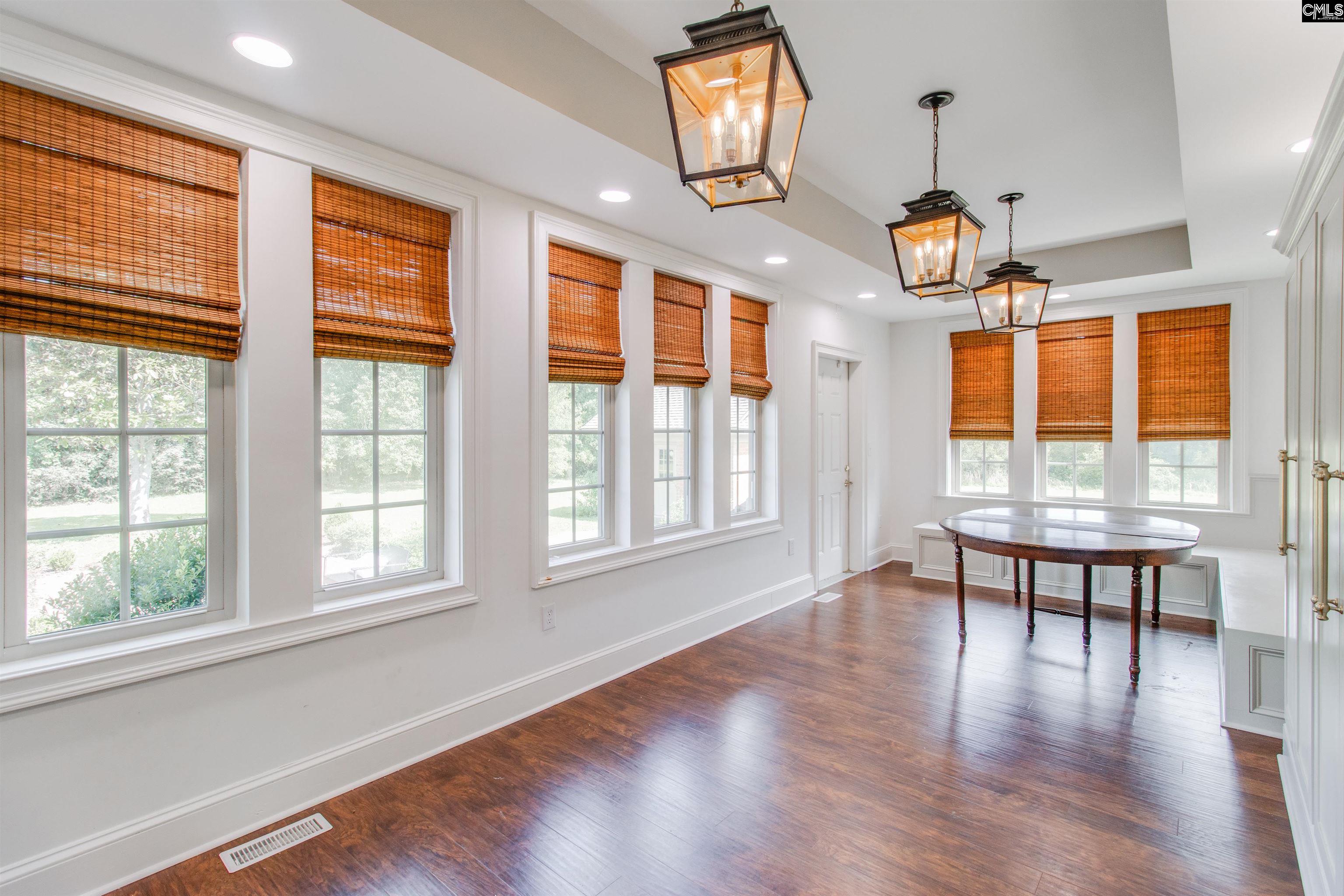 701 Longtown Road Columbia, SC 29229 - Photo 8 of 26 an empty room with wooden floor and windows