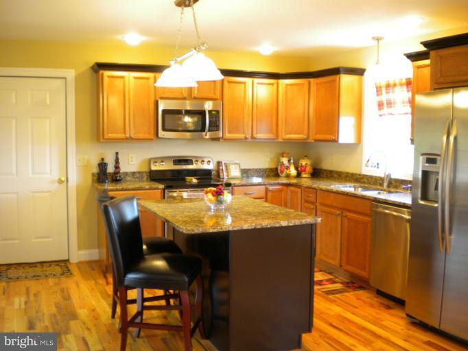 119 Fantasia Road Inwood, WV 25428 - Photo 16 of 30 Kitchen with Granite Counter tops