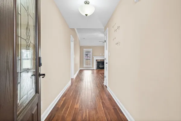 a view of gallery with wooden floor