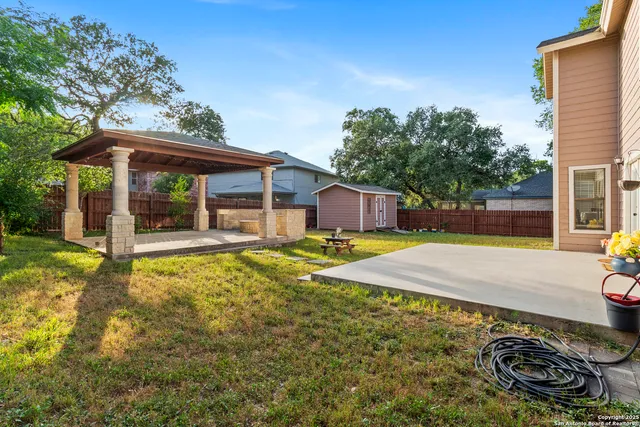 a house view with a backyard space
