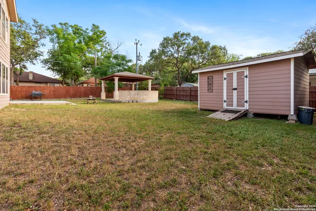 a house with trees in the background