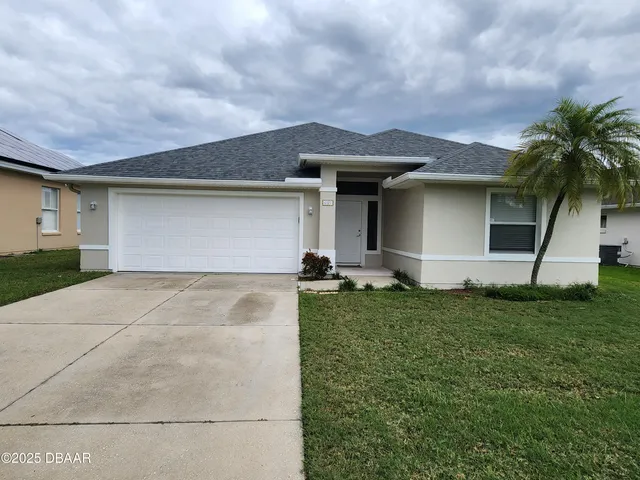 a front view of house with yard
