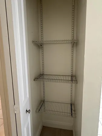 an aerial view of a house with a yard and a garage