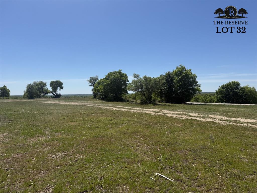 Lot 32 Colt Road Springtown, TX 76082 - Photo 5 of 18 a view of a field with an trees in the background