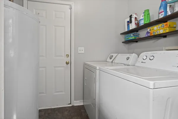 a bedroom with a bed and a ceiling fan