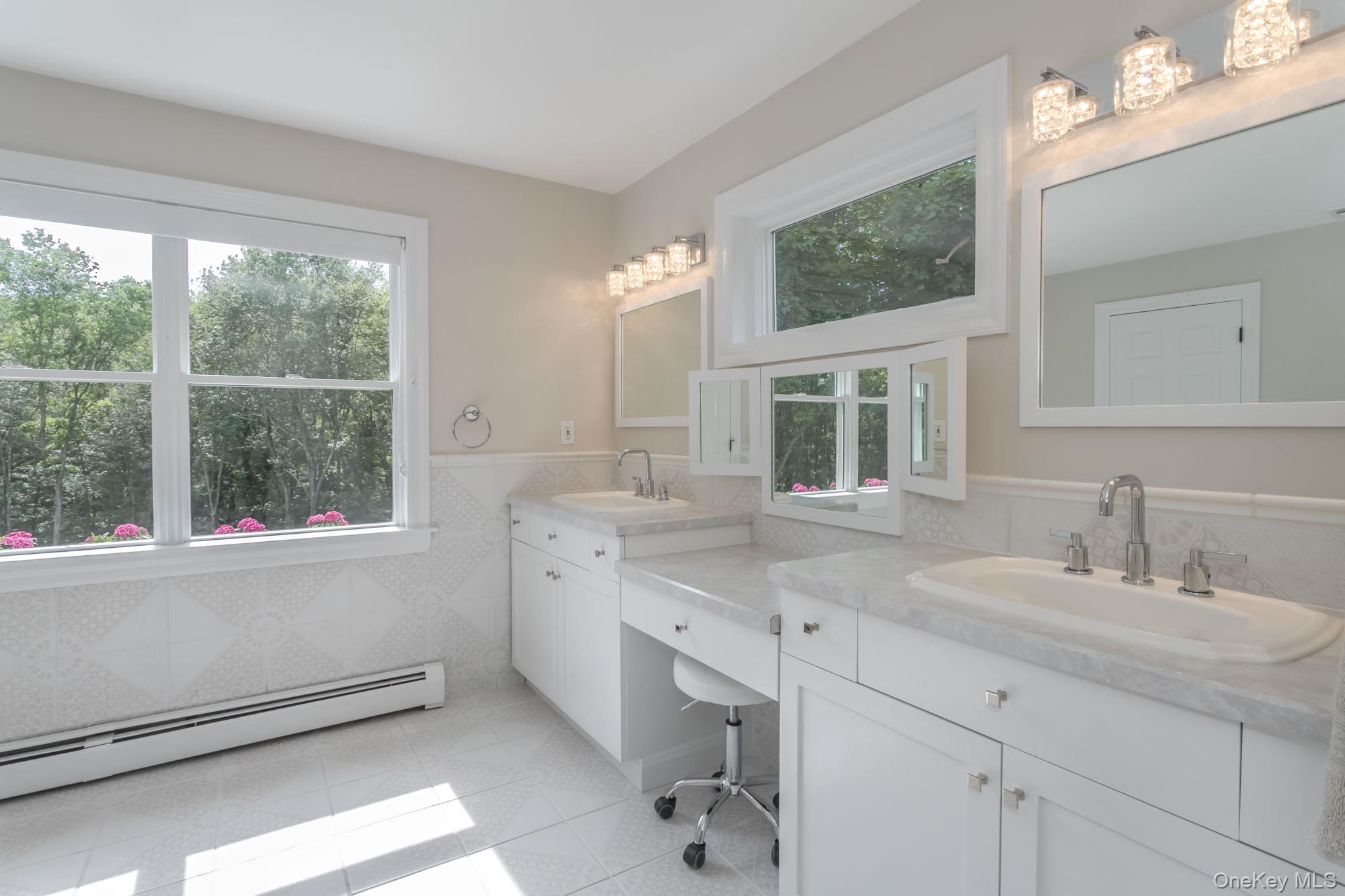 102 Beverly Road Chester, NY 10918 - Photo 31 of 49 a bathroom with a sink double vanity and a mirror