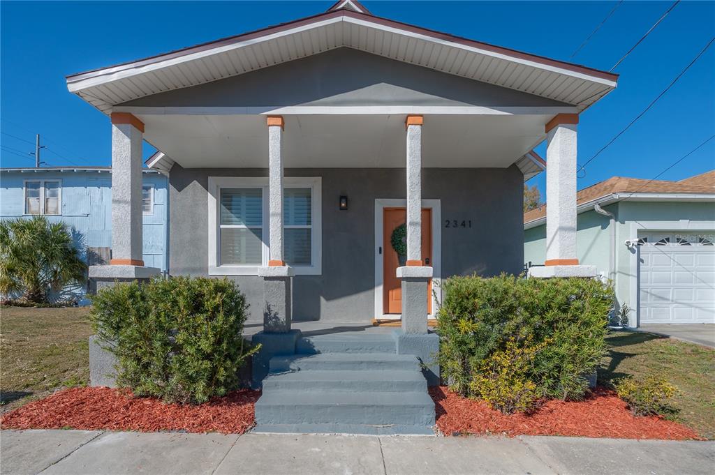 2341 West Chestnut Street Tampa, FL 33607 - Photo 1 of 42 a front view of a house with garden