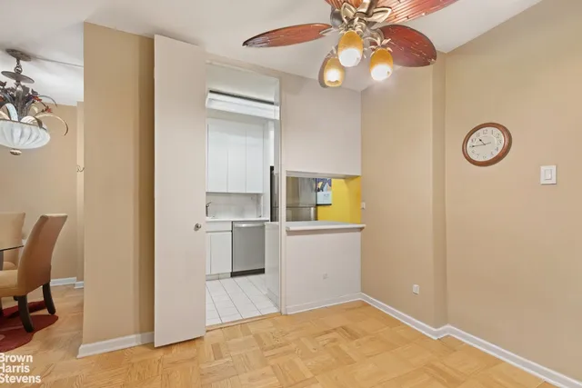 a view of storage and utility room with a window
