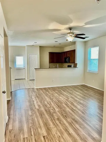 a view of a livingroom and a kitchen