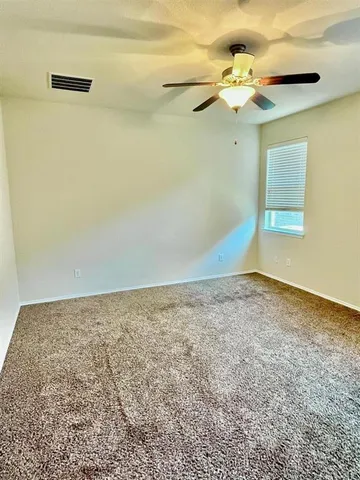 a view of a room with rack and wooden floor