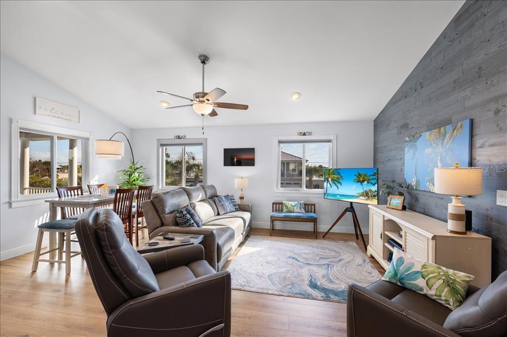 4452 Kingston Drive Hernando Beach, FL 34607 - Photo 18 of 47 a living room with furniture and a wooden floor