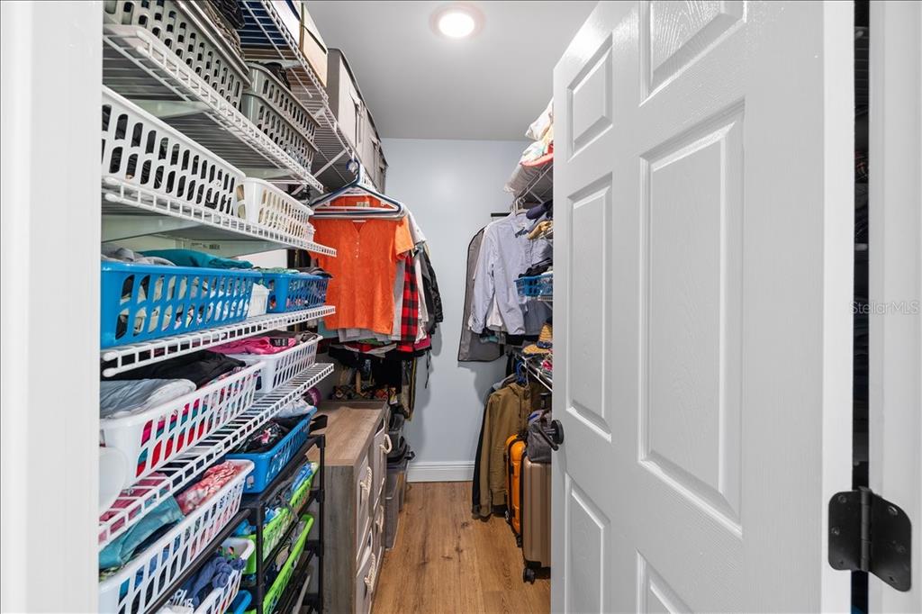 4452 Kingston Drive Hernando Beach, FL 34607 - Photo 23 of 47 a view of walk in closet with clothes