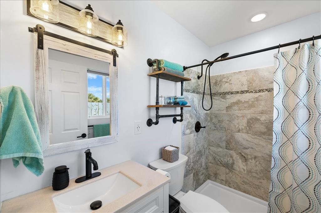 4452 Kingston Drive Hernando Beach, FL 34607 - Photo 24 of 47 a bathroom with a sink and a mirror