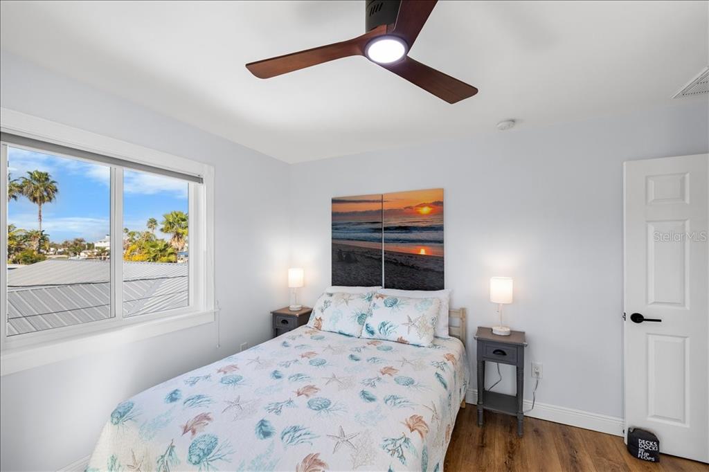 4452 Kingston Drive Hernando Beach, FL 34607 - Photo 30 of 47 a bedroom with a bed and a dresser