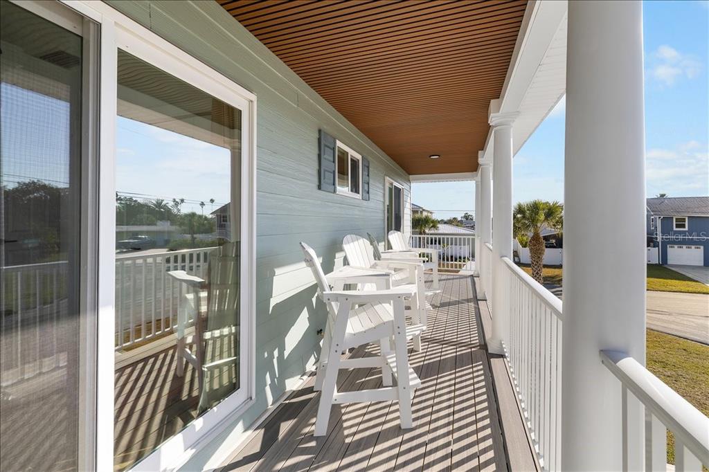 4452 Kingston Drive Hernando Beach, FL 34607 - Photo 31 of 47 a balcony with table and chairs