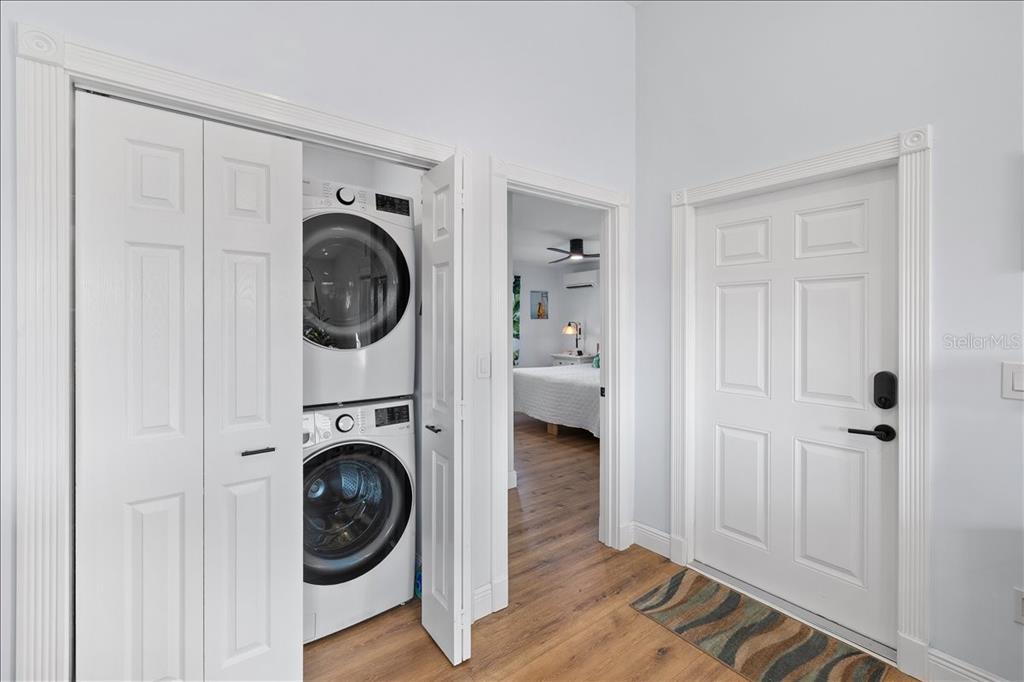 4452 Kingston Drive Hernando Beach, FL 34607 - Photo 32 of 47 a view of a bedroom with washer and dryer