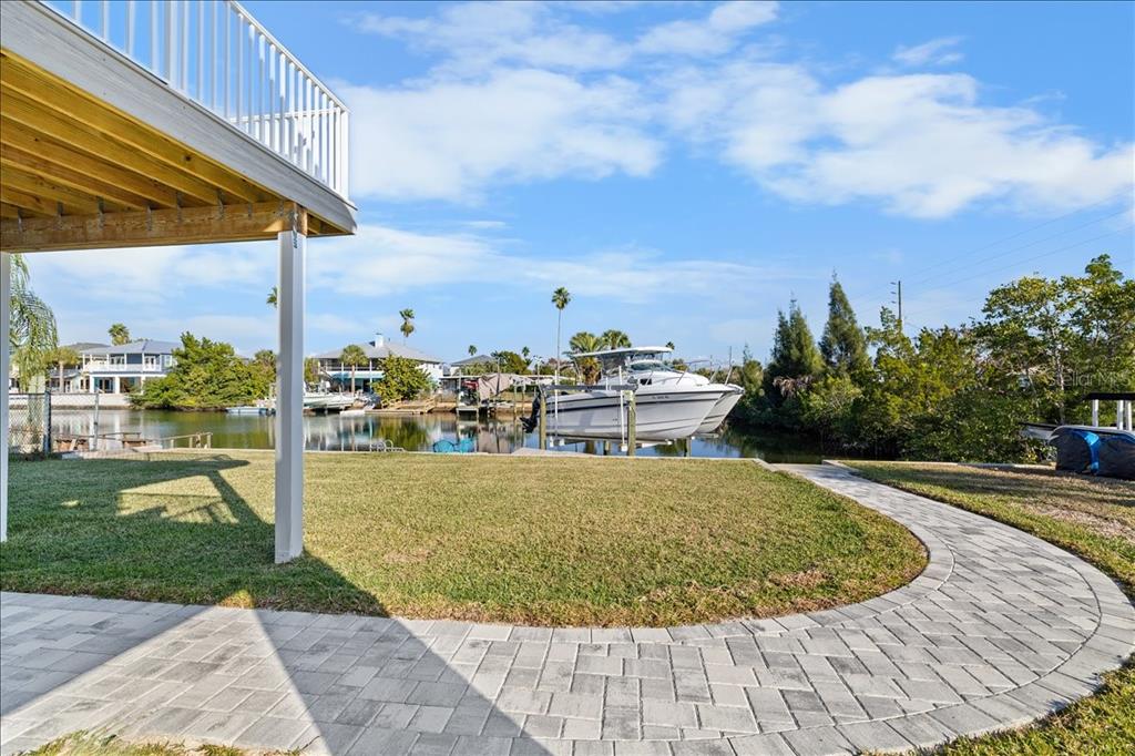 4452 Kingston Drive Hernando Beach, FL 34607 - Photo 37 of 47 a view of a swimming pool with a yard