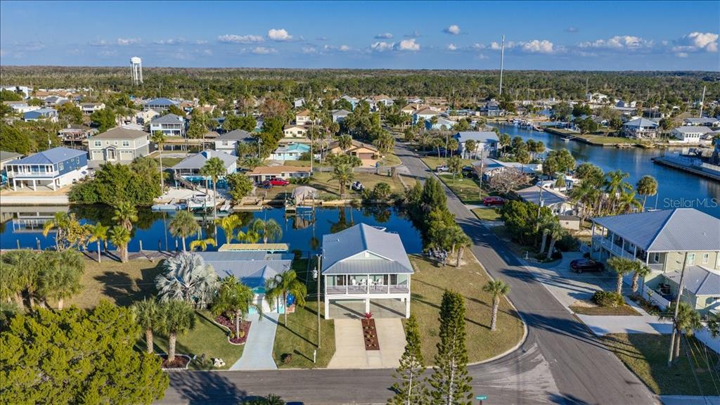 4452 Kingston Drive Hernando Beach, FL 34607 - Photo 6 of 47 an aerial view of a houses with a swimming pool