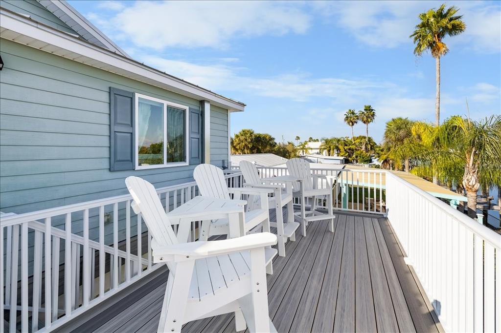 4452 Kingston Drive Hernando Beach, FL 34607 - Photo 9 of 47 a view of a balcony with furniture