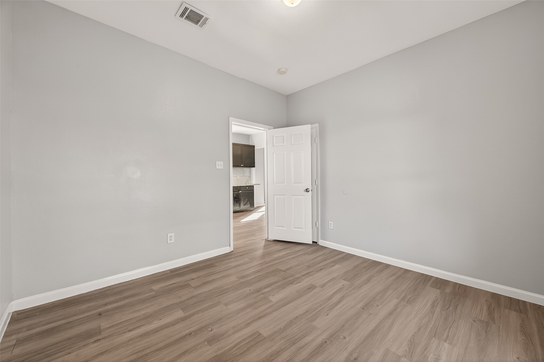 8211 Parnell Street Houston, TX 77051 - Photo 8 of 22 a view of an empty room with wooden floor