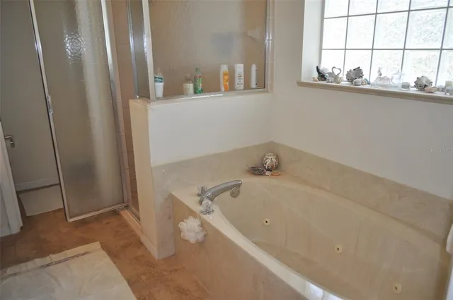 a bathroom with a tub and sink