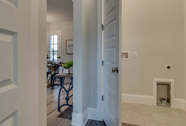 wooden floor with windows and closet