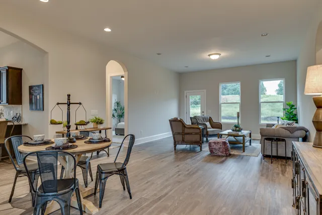 a view of a dining room with furniture window and wooden floor