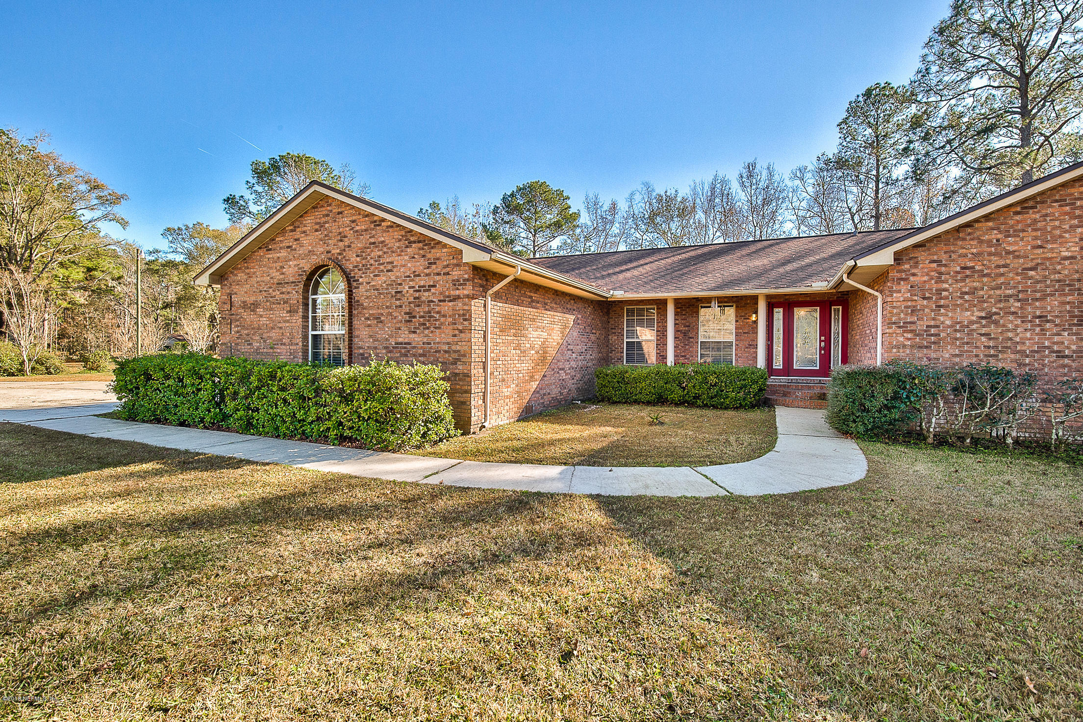 45184 Stratton Road Callahan, FL 32011 - Photo 4 of 52 a front view of a house with a yard