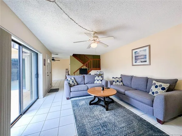 a living room with furniture and a rug