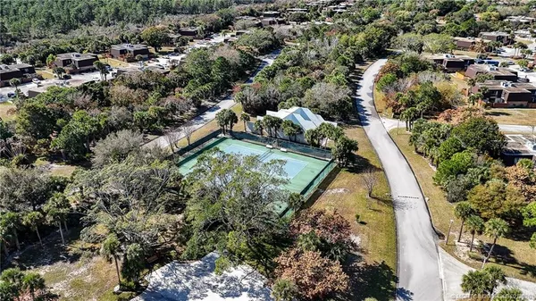 an aerial view of house with yard