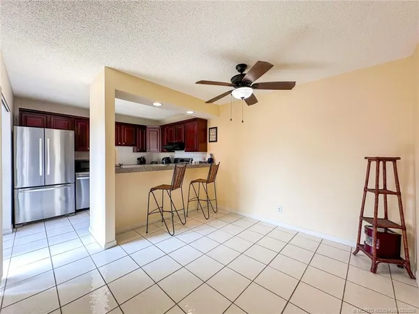 a view of kitchen with microwave and cabinets