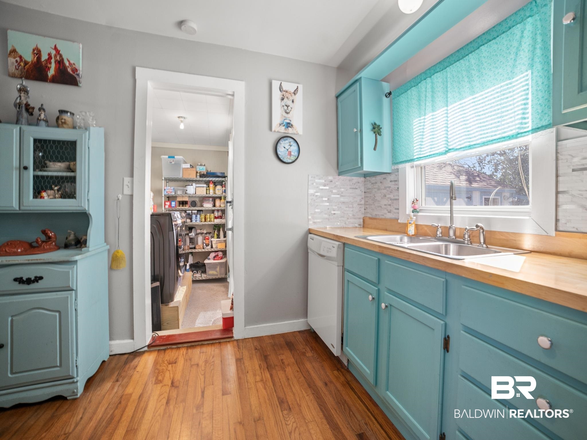 18744 Fairground Road Robertsdale, AL 36567 - Photo 5 of 20 Kitchen with sink, wooden counters, white dishwasher, decorative backsplash, and light wood-type flooring