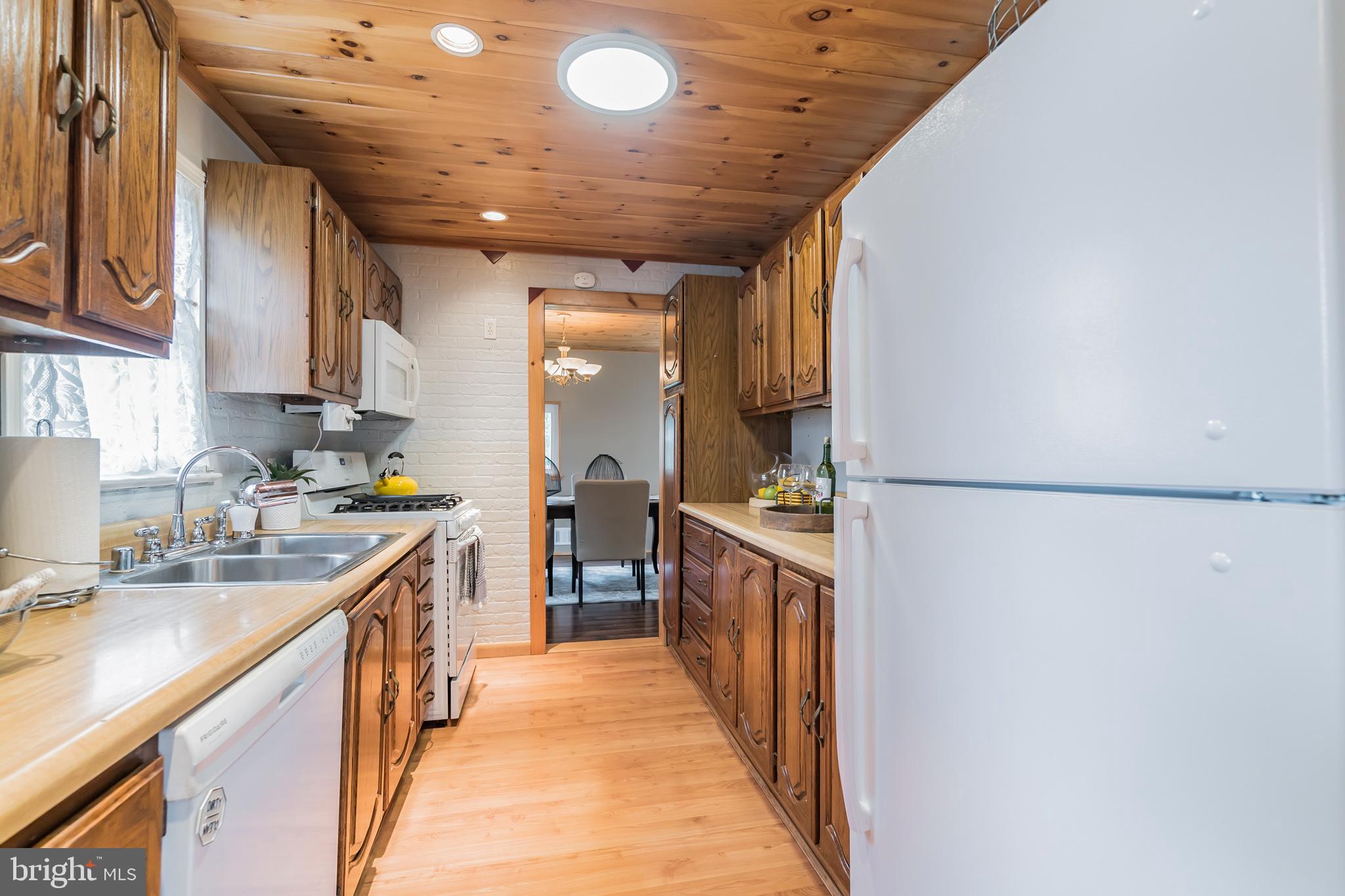 1003 Gilbert Road Rockville, MD 20851 - Photo 7 of 27 Gally kitchen with gas cooking.