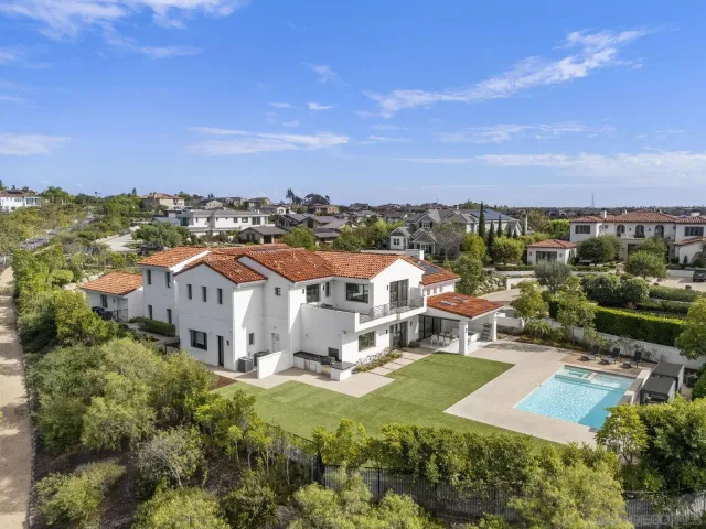 an aerial view of a house with a garden