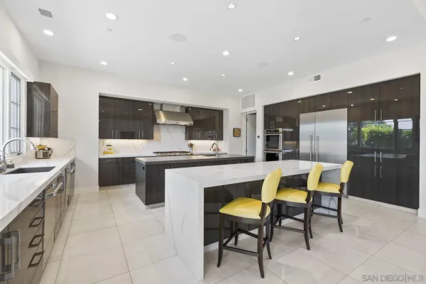 a kitchen with a sink cabinets and window