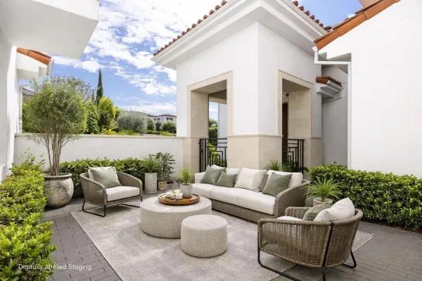 a building outdoor space with patio furniture and potted plants