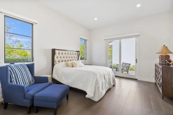 a bedroom with a bed and a couch