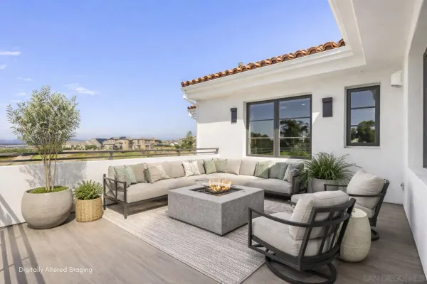 a living room with furniture a rug and a window