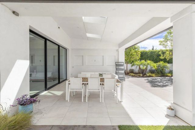 a view of balcony with furniture