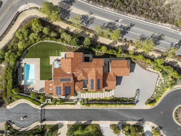 an aerial view of residential building and lake